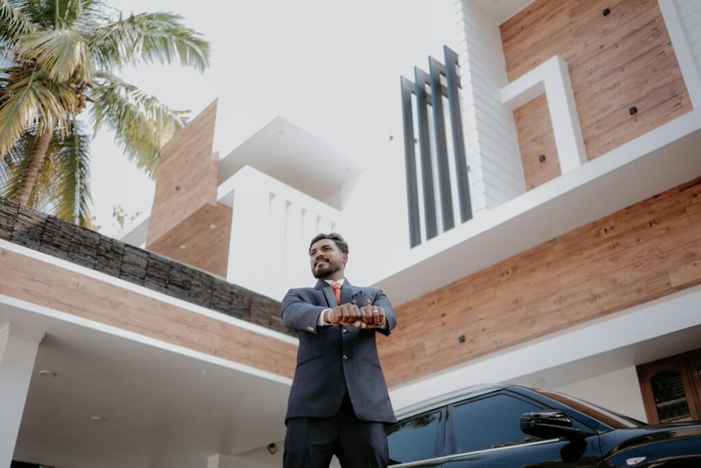 Business Astrology in Mumbai: Businessman in a suit beside a luxury car