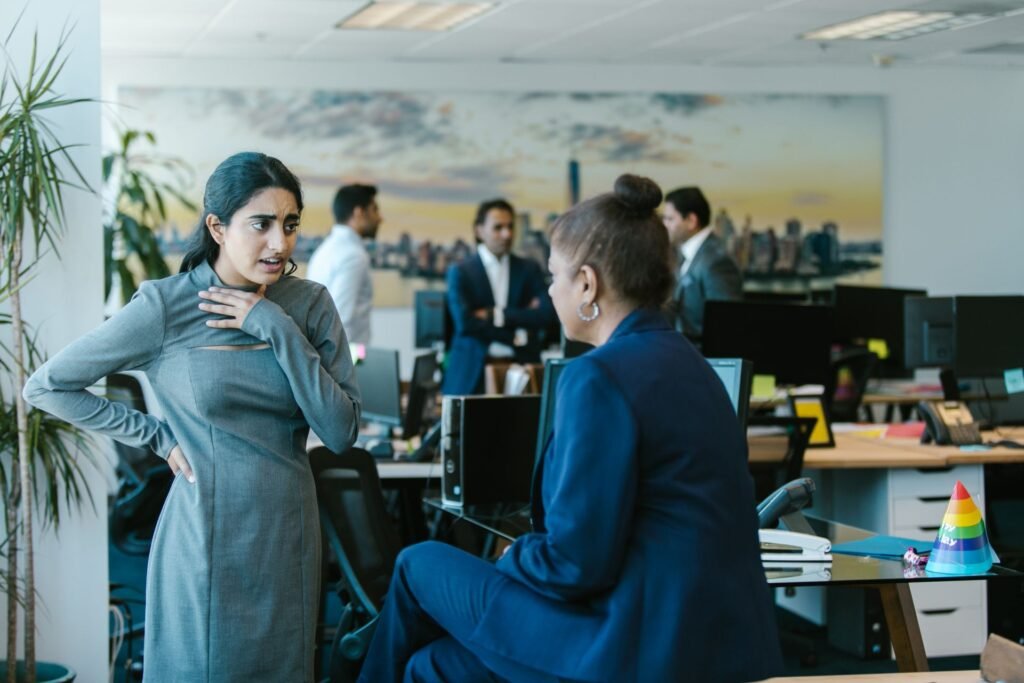 Career Astrology in Mumbai: Colleagues discussing work in an office