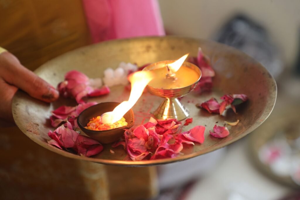 Janam Kundli Reading in Mumbai: Puja thali with a lit diya